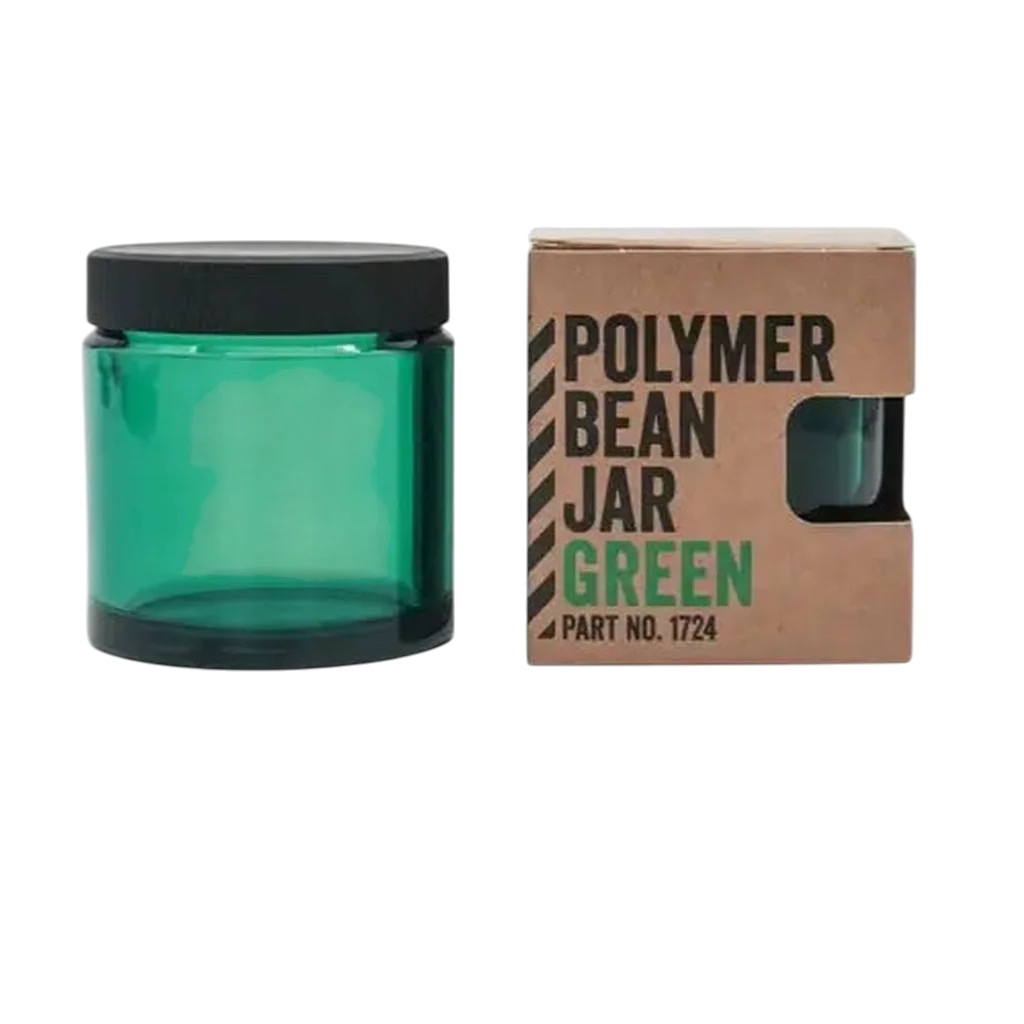 Comandante Ersatzbehälter in grün mit Deckel neben der Verpackung 